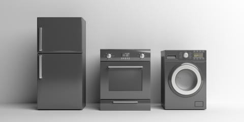 Gray refrigerator with a gray oven and gray washing machine 